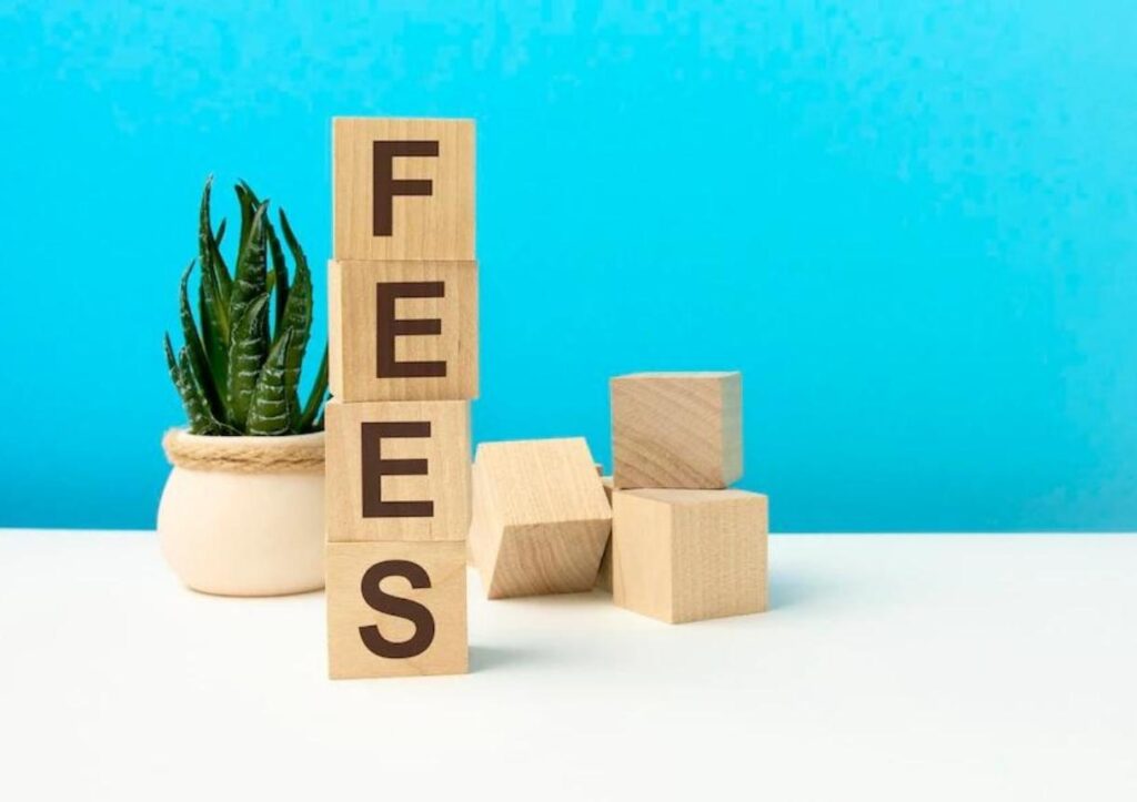 Fees word is written on wooden cubes