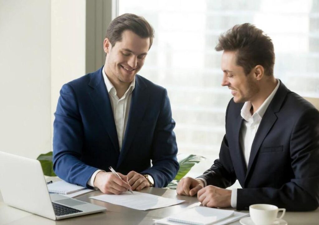 businessman signing contract with partner