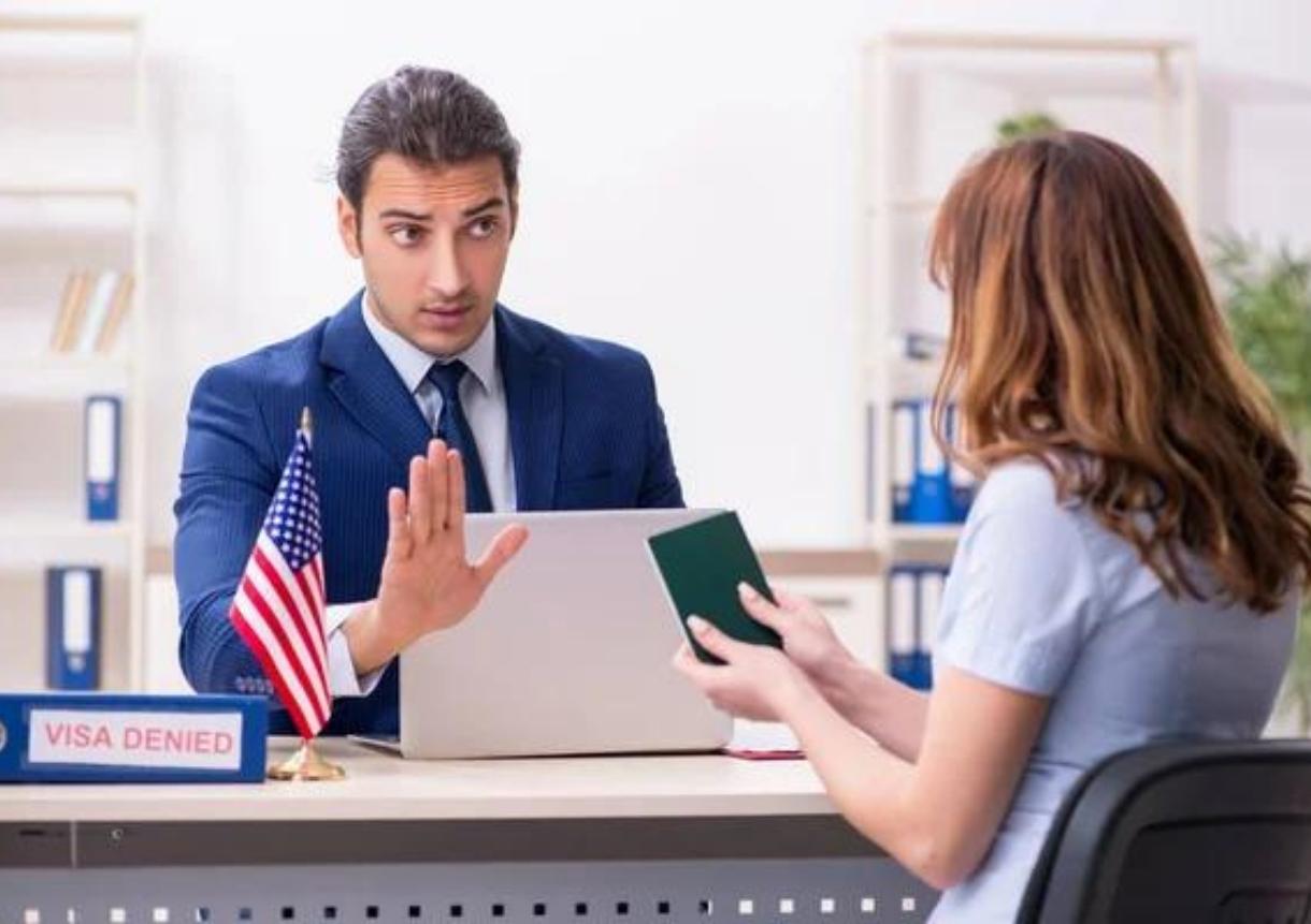 Young woman visiting american embassy for visa