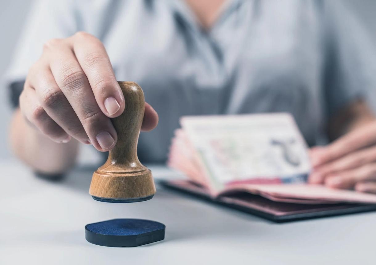 officer puts a stamp in the US passport